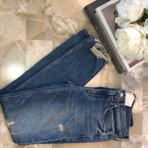 Some distressing on leg and distressed ankles